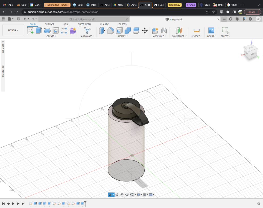 Shows another angled aerial view of the same water bottle. This time the attachment loop is facing the viewer. 
